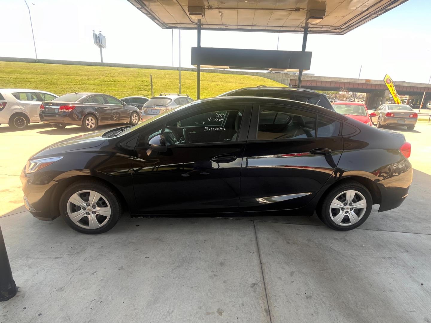 2017 BLACK CHEVROLET CRUZE LS LS Auto (1G1BC5SM1H7) with an 1.4L L4 DOHC 16V TURBO engine, 6A transmission, located at 8101 E. Skelly Dr., Tulsa, OK, 74129, (918) 592-3593, 36.121891, -95.888802 - Photo#1